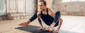Male yoga in class, balance training